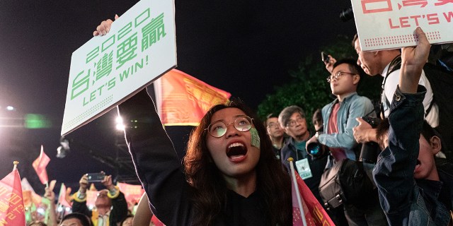 Supporters of Taiwan's Democratic Progressive Party celebrate President Tsai Ing-wen's reelection in Taipei on Jan. 11, 2020. (Yat Kai Yeung/NurPhoto via Getty Images)