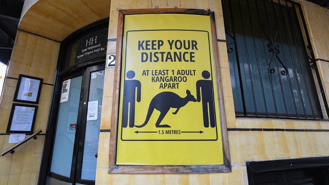 A sign outside a hotel in Sydney, Australia warning people to keep their distance. (James D. Morgan/Getty Images)
