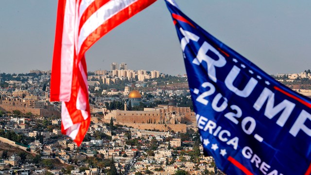 A photo of an American flag and a Trump campaign flag fly in Jerusalem in October 2020, with the Temple Mount visible in the background. (Emmanuel Dunand/AFP via Getty Images)