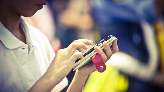 A photo of people using cellphones. (Getty Images)