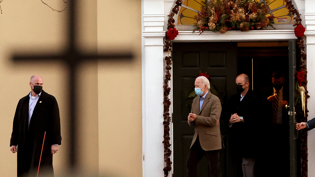 Shadowed by his security detail, then U.S. President-elect Joe Biden leaves St. Joseph's on the Brandywine Roman Catholic church in January 2021, where his family regularly attends services. (Chip Somodevilla/Getty Images)