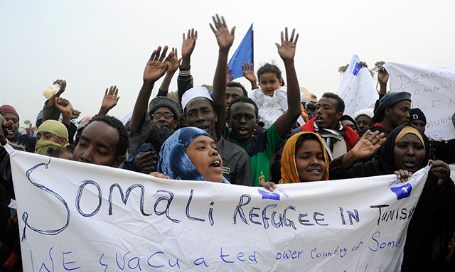 Somali refugees fleeing Libya demonstrate at the Choucha refugee camp near the Tunisian border in March 2011. (Dominique Faget/AFP/Getty Images)