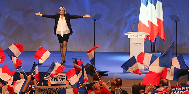 Marine Le Pen, National Front candidate for the French presidential election, addresses supporters at the start of a conference in Nantes, France, on Feb. 26. (David Vincent/AP)