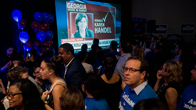 Supporters at Democratic candidate Jon Ossoff's election night watch party are stunned as CNN calls the race for Republican Karen Handel in the June 20 special election to fill the seat vacated by current Health and Human Services Secretary Tom Price. (Bill Clark/CQ Roll Call)