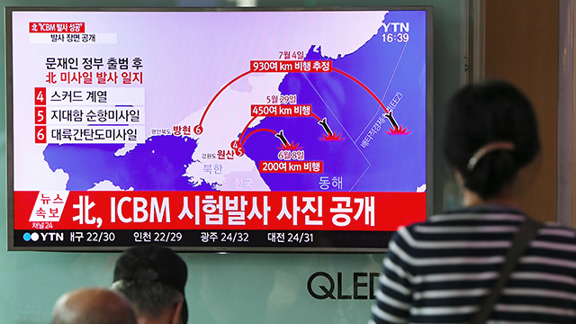 People at a railway station in Seoul watch as television news depicts North Korea's missile test on July 4. North Korea said it had successfully tested an intercontinental ballistic missile capable of hitting the United States with a nuclear weapon. (Jung Yeon-Je/AFP/Getty Images)