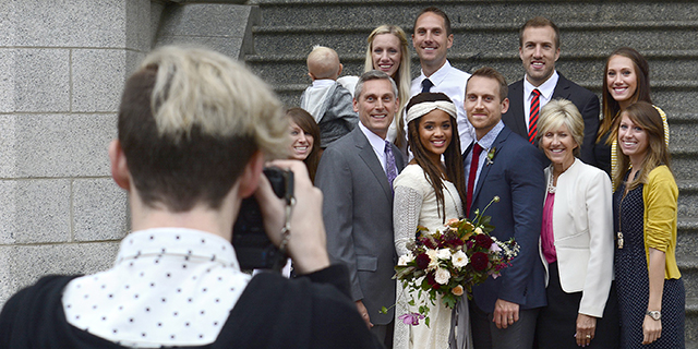 Members of a wedding party pose after a Mormon ceremony at Salt Lake Temple in Salt Lake City. (Robert Alexander/Getty Images)