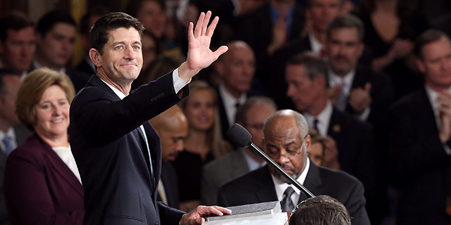 House Speaker Paul Ryan waves to colleagues at the Capitol shortly after his election to the leadership position in October 2015. (Win McNamee/Getty Images)