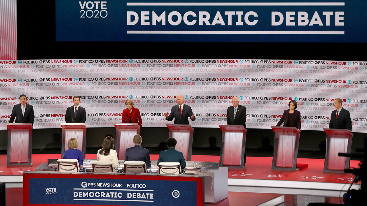 Presidential candidates on stage at the sixth Democratic primary debate. (Mario Tama/Getty Images)