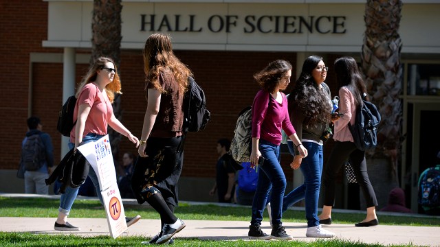 Americans generally support making tuition free at public colleges and universities for all U.S. students. Pictured are students at Long Beach State University in California in 2017. 