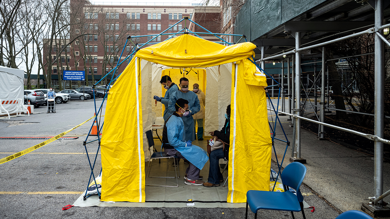 Doctors test hospital staff with flu-like symptoms for COVID-19 at St. Barnabas hospital on March 20, 2020, in New York City. (Misha Friedman/Getty Images)