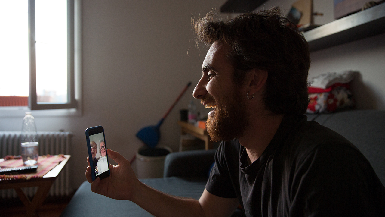 A man in Bologna, Italy, chats online with his grandparents on March 19. A nationwide lockdown to control the spread of COVID-19 has been extended to at least Easter. (Massimo Cavallari/Getty Images)