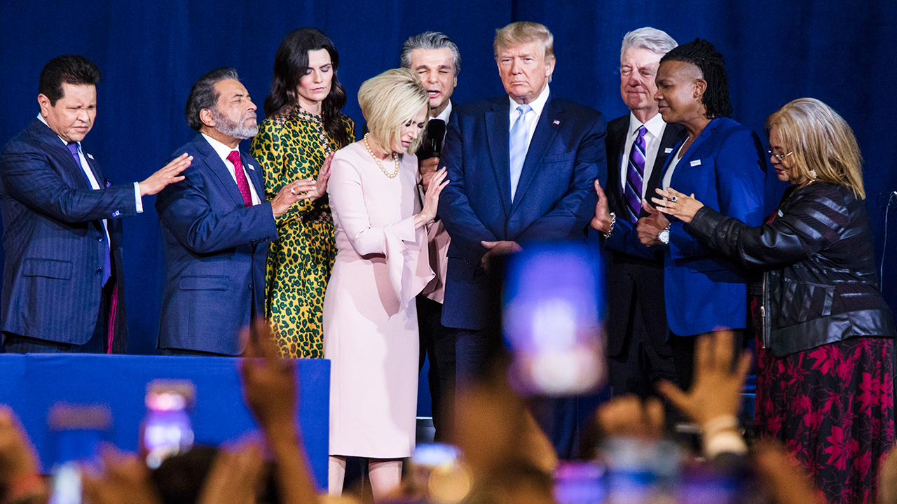 Religious leaders pray with President Donald Trump during a January rally in Florida. (Scott McIntyre/The Washington Post via Getty Images)