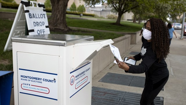 An Ohio voter drops off her ballot at the Board of Elections in Dayton, Ohio, on April 28, 2020. (Megan Jelinger/AFP via Getty Images)
