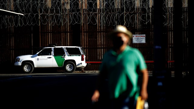 A Border Patrol truck sits on the U.S. side of a wall separating Mexicali, Mexico, from Calexico, California, on July 21, 2020. (Gregory Bull/AP)