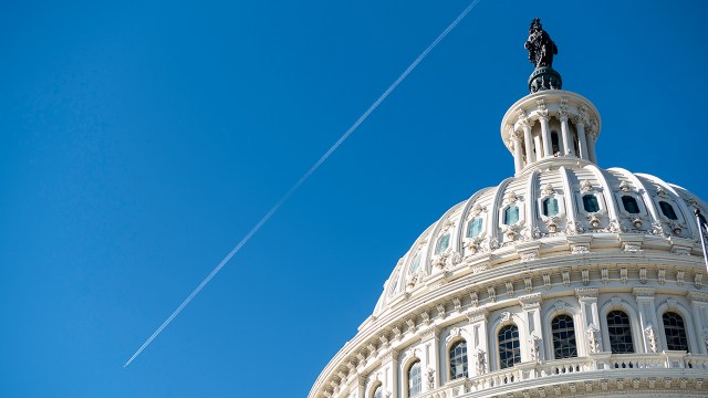 A jet leaves a contrail over the Capitol dome on Friday, Nov. 20, 2020. (Bill Clark/CQ Roll Call via Getty Images)