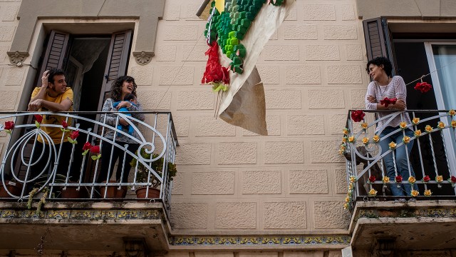 Neighbors speak from their balconies on April 23, 2020, in El Prat del Llobregat, Spain. (David Ramos/Getty Images)