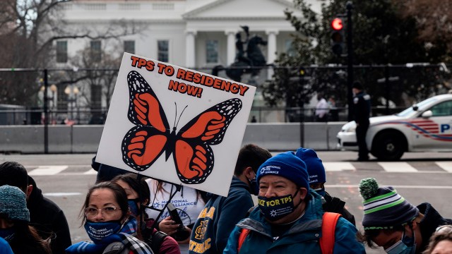 Activists march toward the White House in 2021 to a call for Congress and the Biden administration to pass legislation granting immigrants with Temporary Protected Status a path to citizenship. (Andrew Caballero-Reynolds/AFP via Getty Images) 