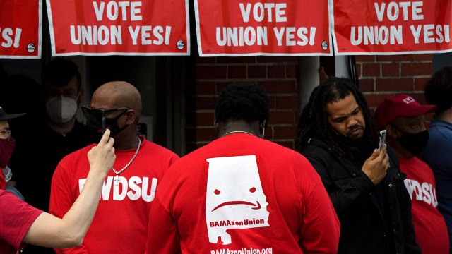 Organizers stand outside the Birmingham, Alabama, office of the Retail, Wholesale and Department Store Union (RWDSU) in support of the unionization of workers at Amazon's warehouse in nearby Bessemer on March 26. (Patrick T. Fallon/AFP via Getty Images)