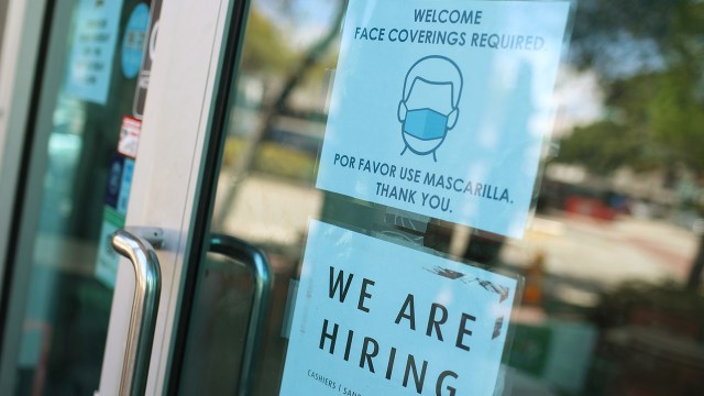A store in Miami announces job openings on March 5, 2021. Despite recent job gains, U.S. employment in February 2021 was 8.5 million less than in February 2020. (Joe Raedle/Getty Images)