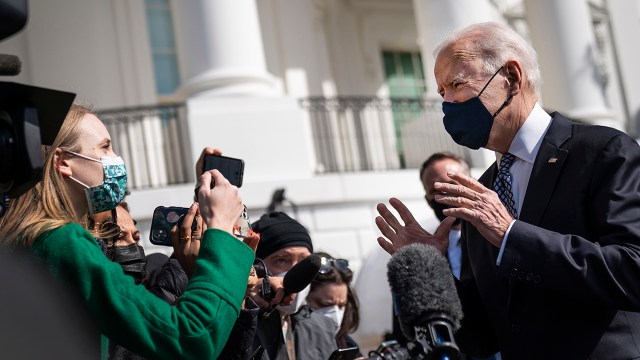 President Joe Biden talks briefly with reporters before boarding Marine One on the South Lawn of the White House on March 19, 2021.