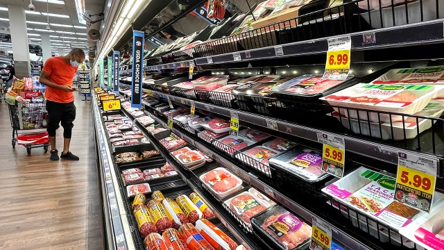 A shopper browses the meat section of a Los Angeles grocery store on Nov. 11, 2021.