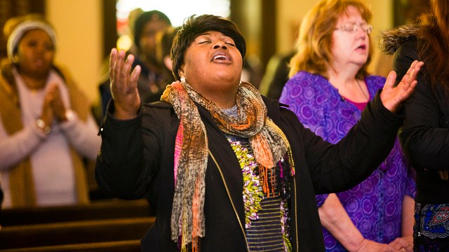 A parishioner who immigrated from the Democratic Republic of the Congo sings during Sunday service in Portland, Maine, in 2017.