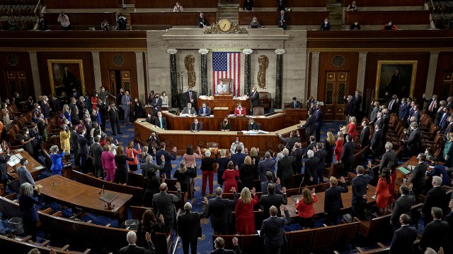 Speaker of the House Nancy Pelosi administers the oath of office to members on Capitol Hill at the opening session on Jan. 3, 2021.