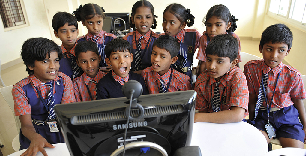Schoolchildren in India interact via Skype; India is home to most of the world’s Hindus and is a country with low overall education levels. (Niklas Halle’n/Barcroft India/Getty Images)